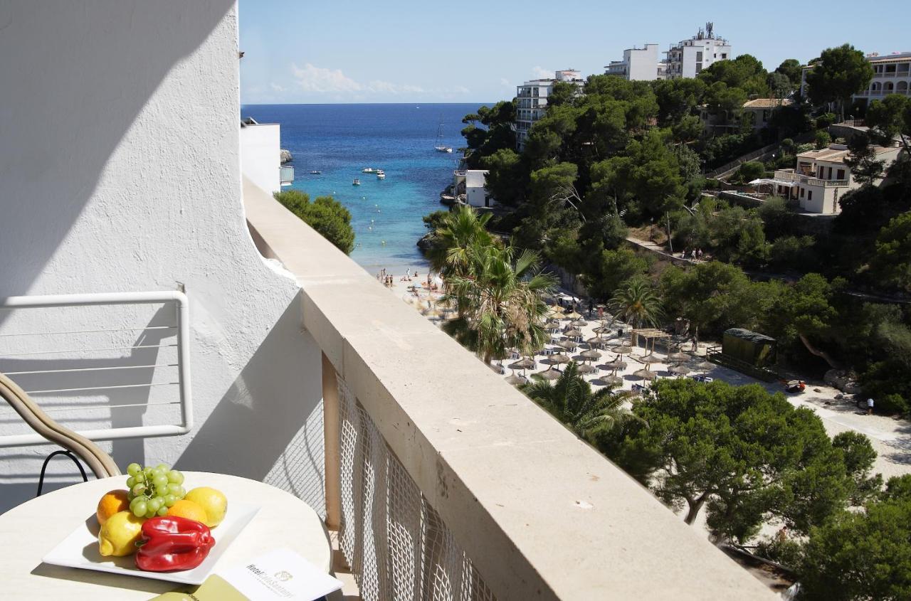 Hotel Apartamentos Cala Сантаний Екстериор снимка